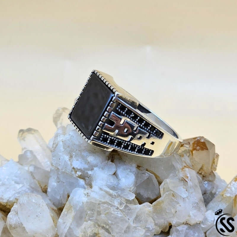 Vintage Turkish 925 sterling silver gents ring with black stone on crystal base, showcasing intricate design.