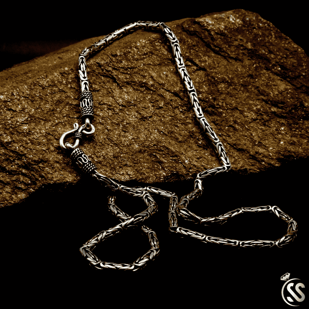 Turkish silver vintage style 925 chain for men, 22 inches long with 4mm width, showcasing intricate design on a stone background.