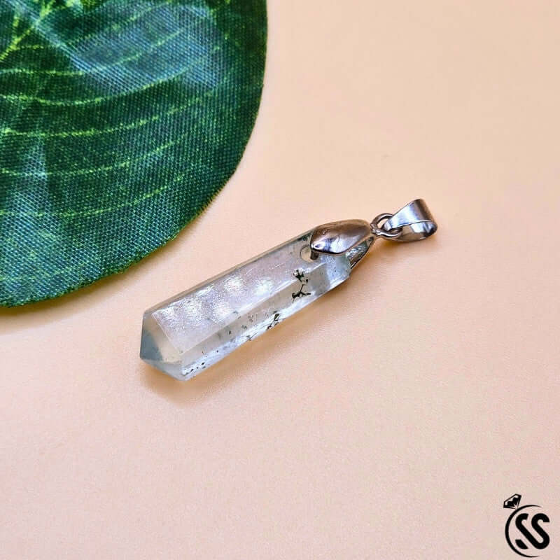 Fluorite real stone pendant showcasing clarity and focus, unique design with stunning colors on a soft background.