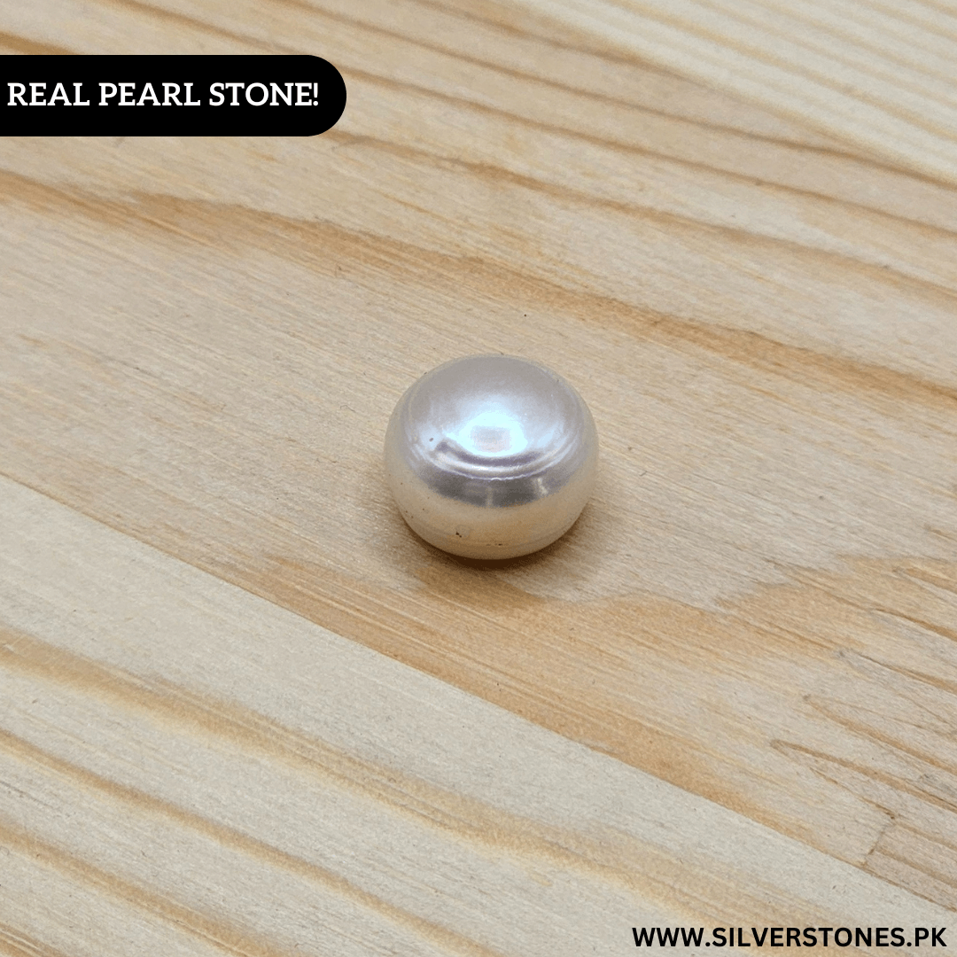 Real Pearl Stone showcasing natural elegance and smooth luster on wooden surface.