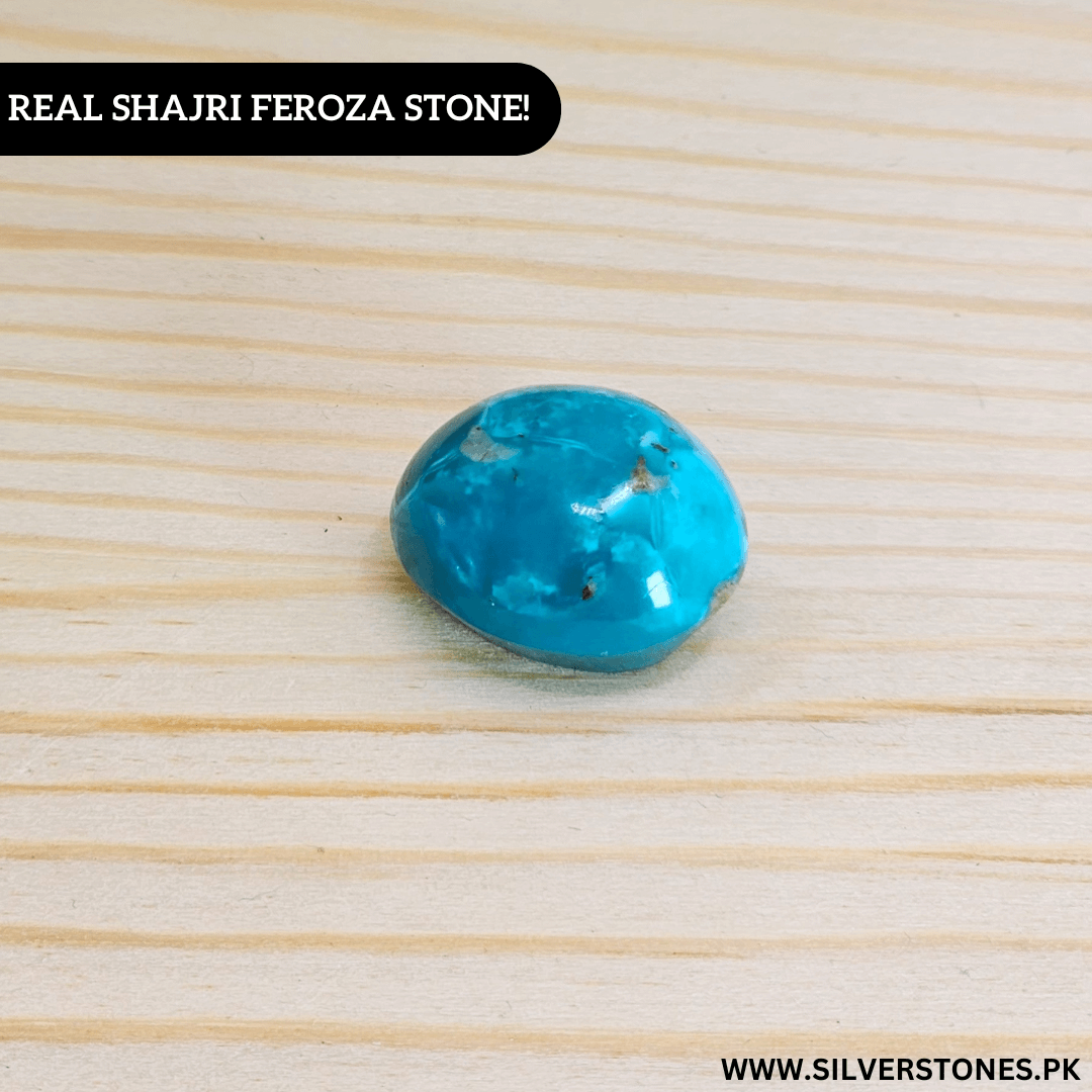 Real Shajri Irani Feroza stone in oval shape, showcasing its vibrant turquoise color and unique natural patterns.