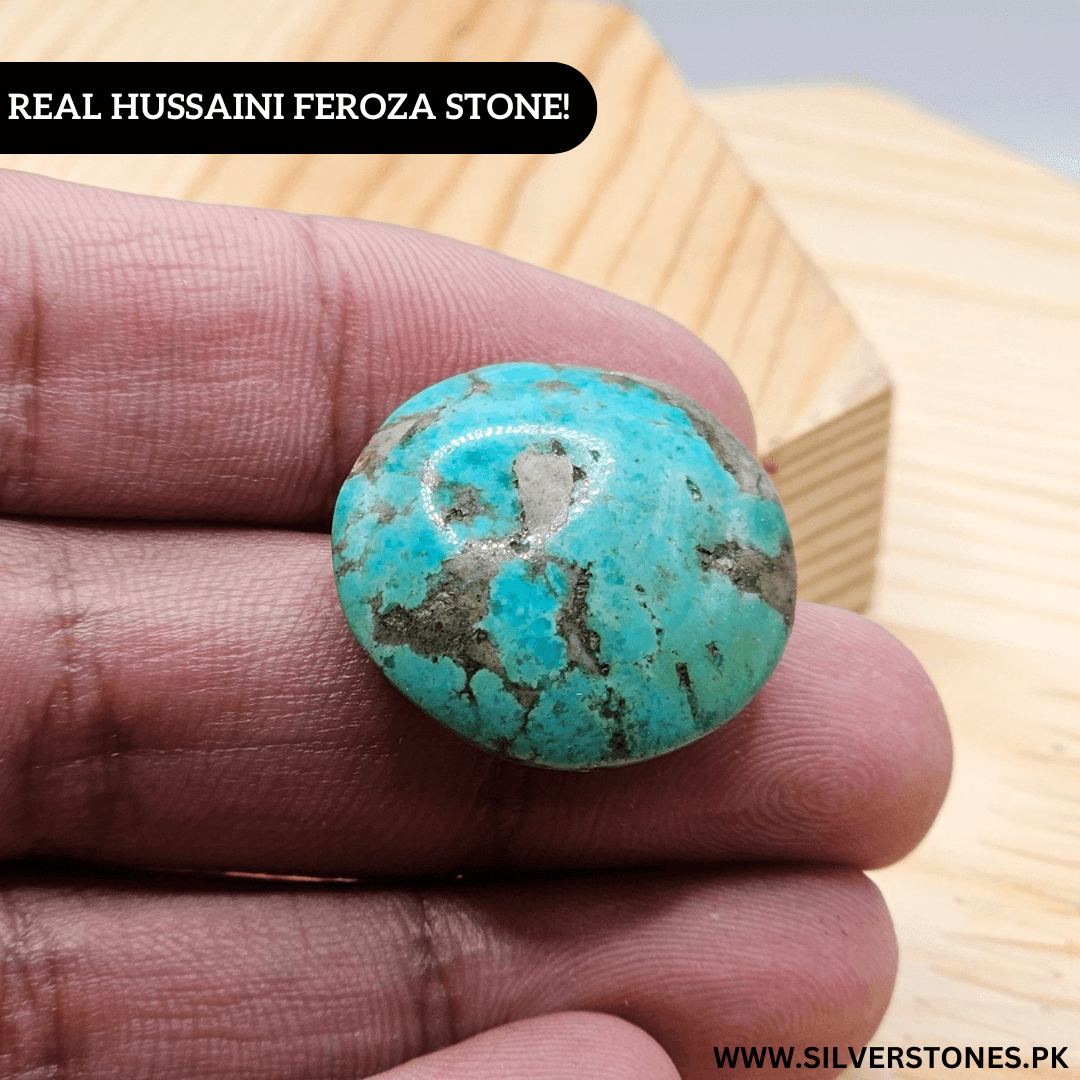 Real Shajri Hussaini Feroza stone, round turquoise piece held in hand, showcasing its unique veins and natural beauty.