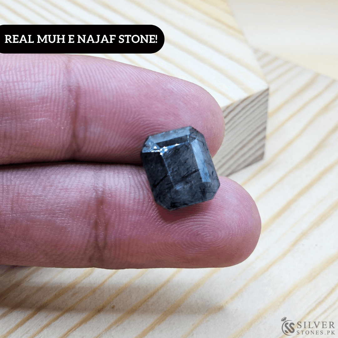 Close-up of a Real Muh-e-Najaf Stone held in hand, showcasing its authentic beauty and unique shape.