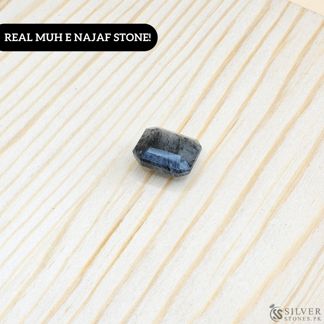 Real Muh-e-Najaf Stone with sacred clarity on wooden backdrop, showcasing its natural beauty and authenticity.