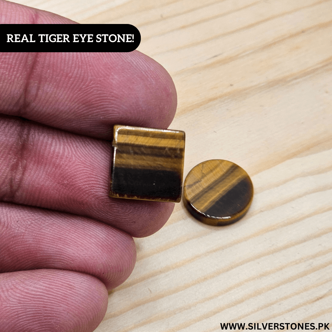 Two pieces of Real Tiger Eye Stone held in hand, showcasing the stone's golden and brown hues.