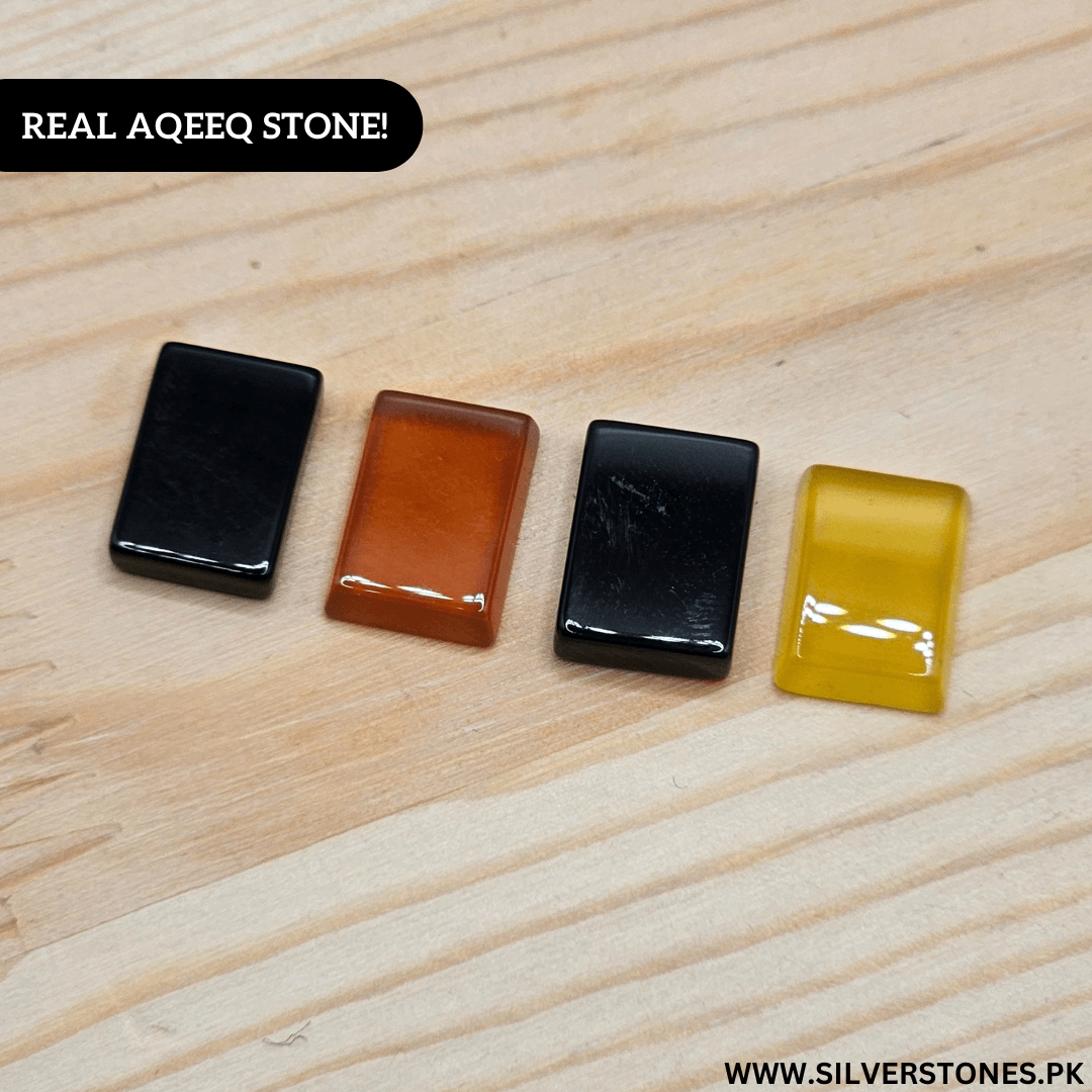 Four Real Yamni Aqeeq Stones in various colors showcasing their natural beauty and spiritual significance.