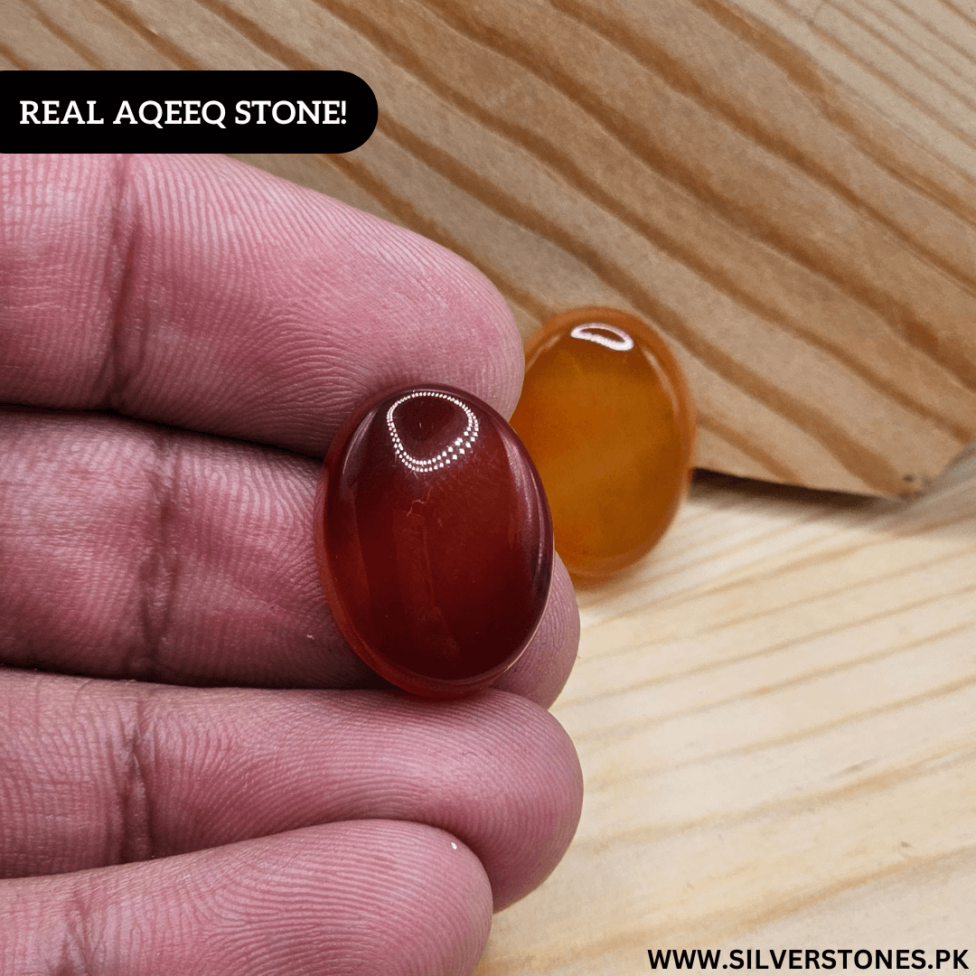 Hand holding a Real Yamni Aqeeq stone showcasing its rich color and natural beauty.