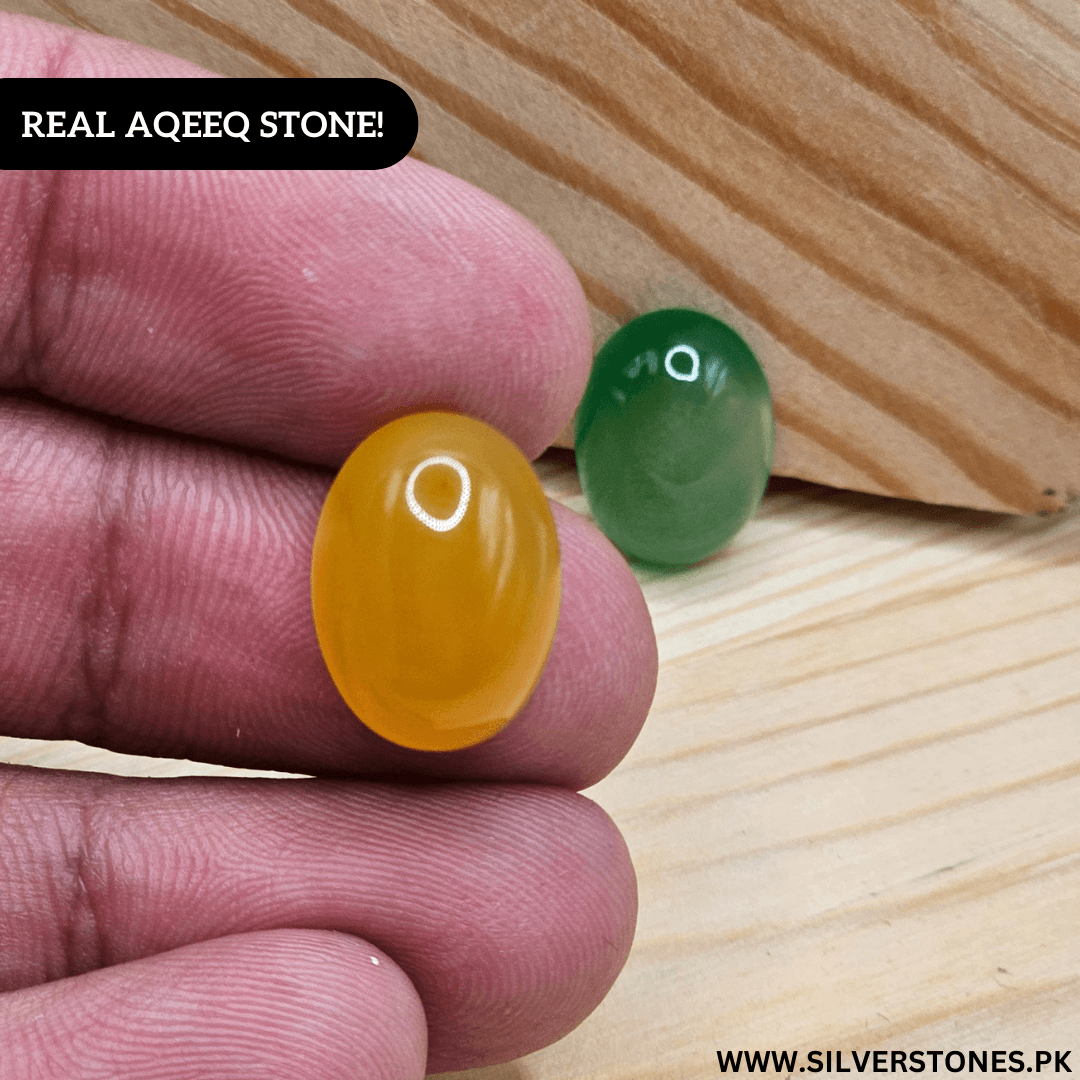 Real Yamni Aqeeq stone in hand showcasing its vibrant yellow color and natural shine.