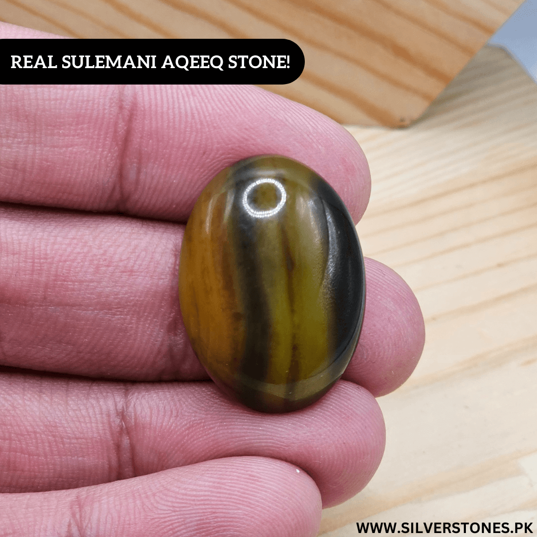Real Sulemani Aqeeq Stone held in hand, showcasing its unique colors and natural beauty.