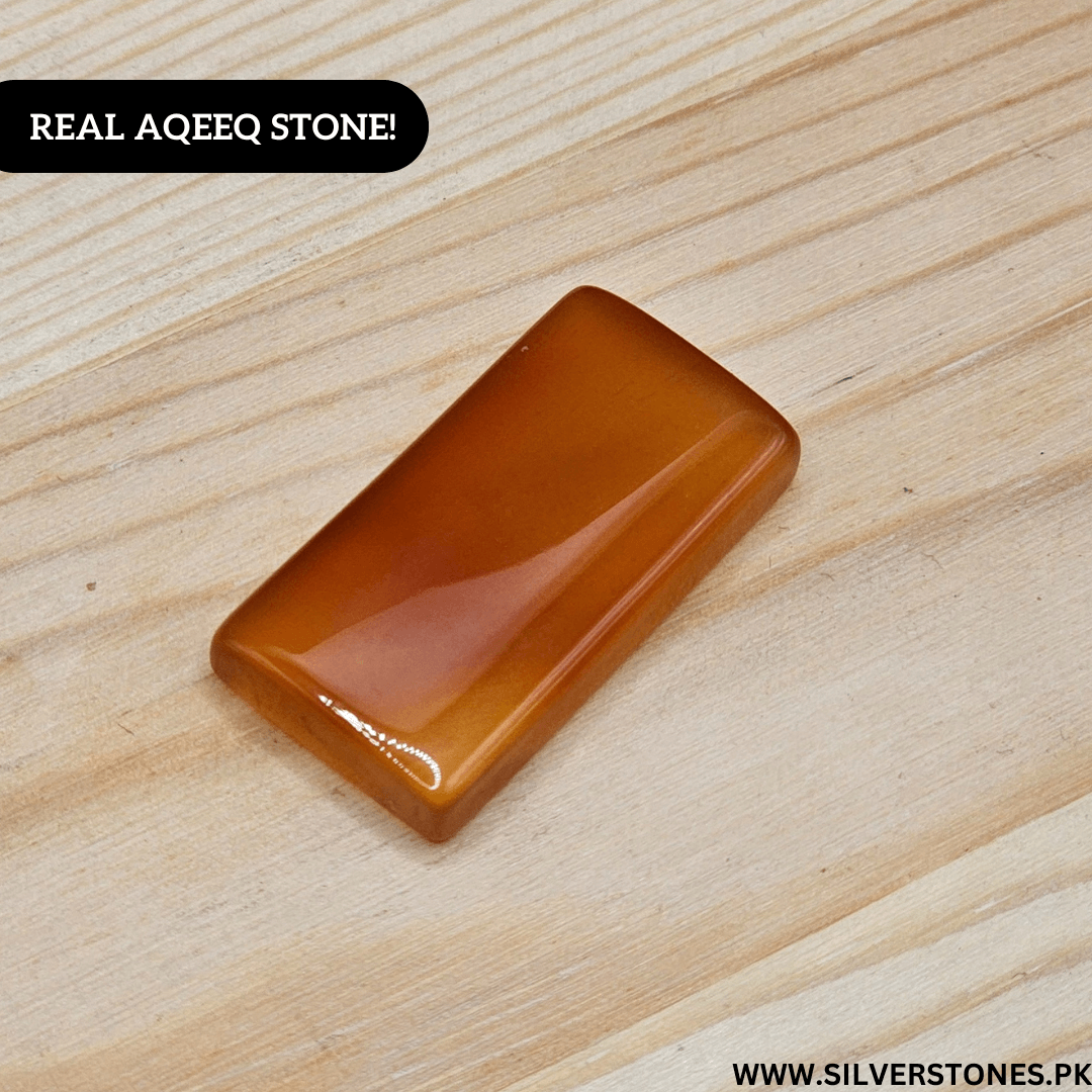 Real Yamni Aqeeq Stone on wooden background showcasing its natural beauty and rich color.