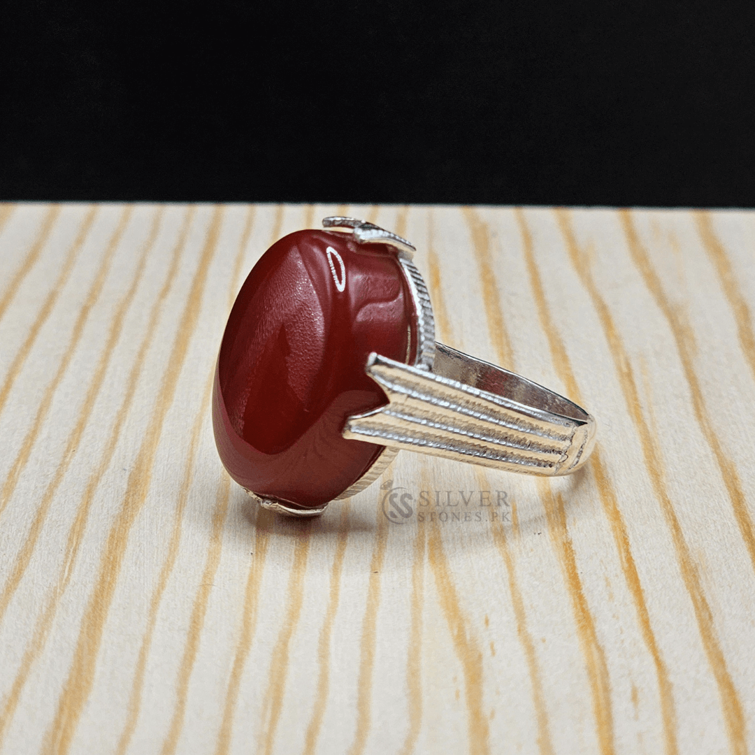 Handmade Real Aqeeq Silver (Chandi) ring showcasing a deep red gemstone, representing strength and protection.