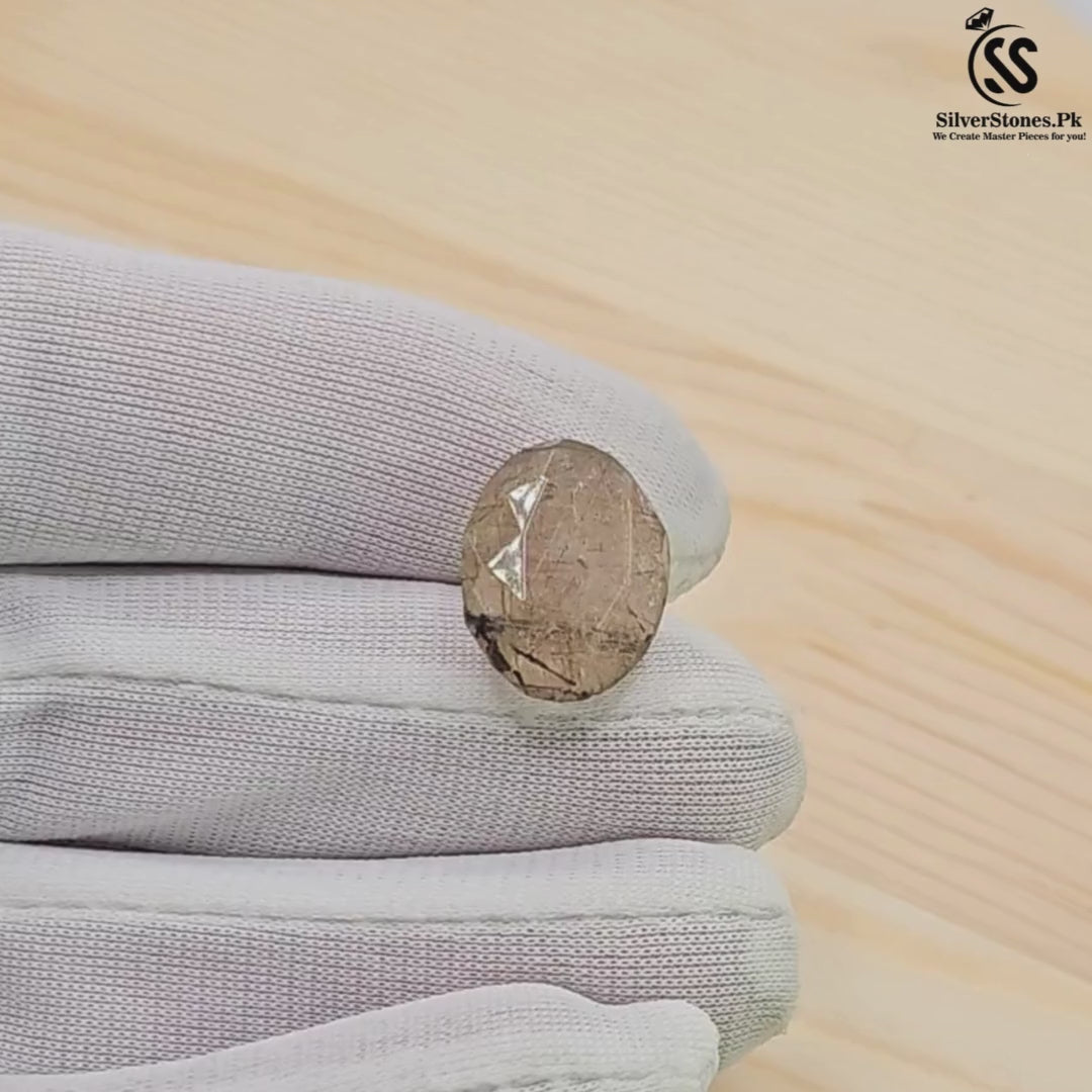 Golden Muh-e-Najaf real stone held in gloved hand, showcasing its unique beauty and authenticity.