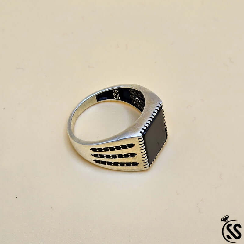 Vintage Turkish 925 sterling silver gents ring featuring a bold black stone and intricate detailing.