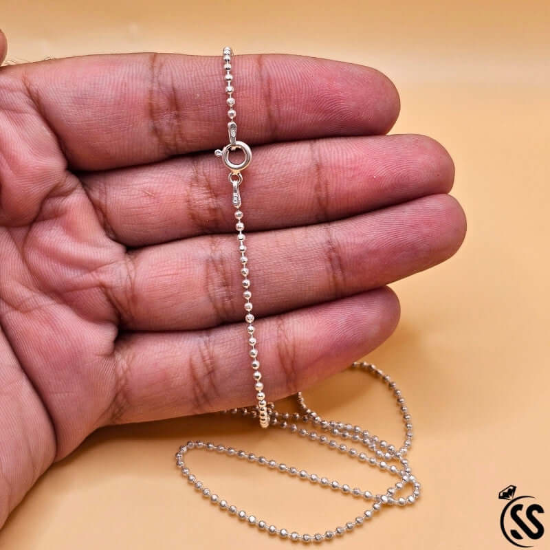 Close-up of Italian Silver Sterling 925 ladies ball chain in a hand, showcasing its 2mm width and polished finish.