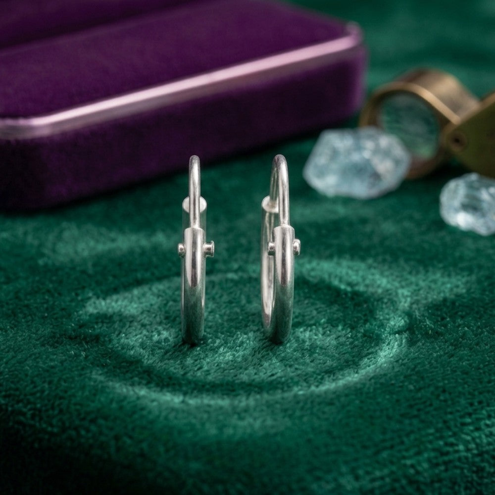 Close up small pure silver hoop earrings polished finish chandi jewelry Pakistan