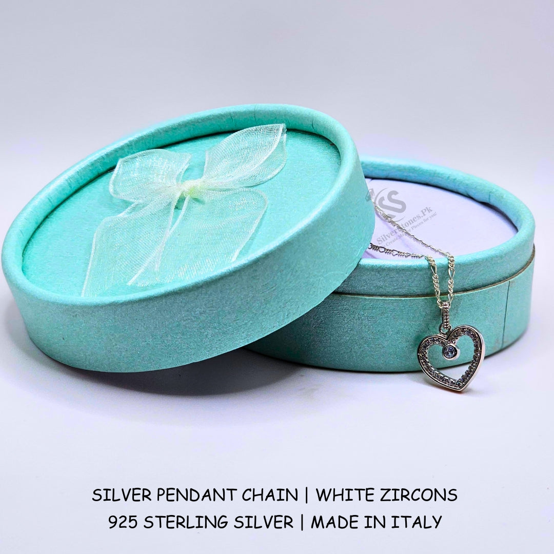 Girl wearing 925 Italian silver heart pendant white zircon figaro chain necklace Pakistan
