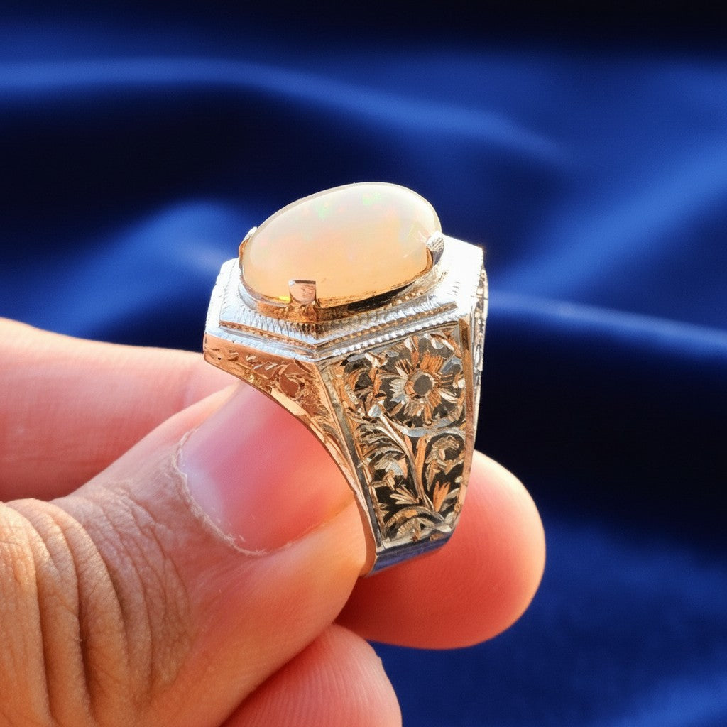 Handmade pure silver ring with real Ethiopian opal stone, showcasing detailed side engraving.
