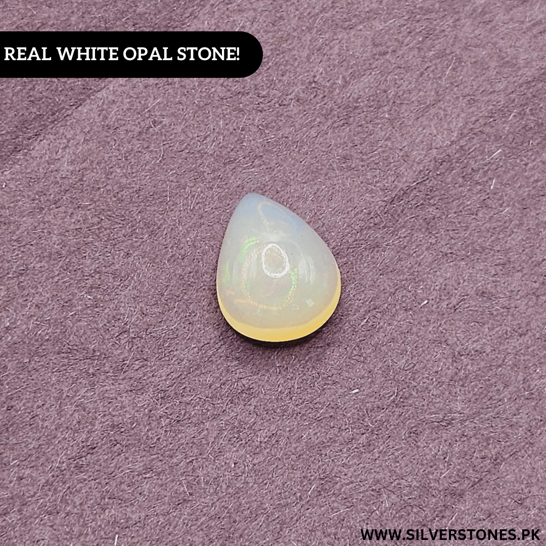 Real White Ethiopian Opal in pear shape, showcasing its luminous glow and play-of-color against a purple background.