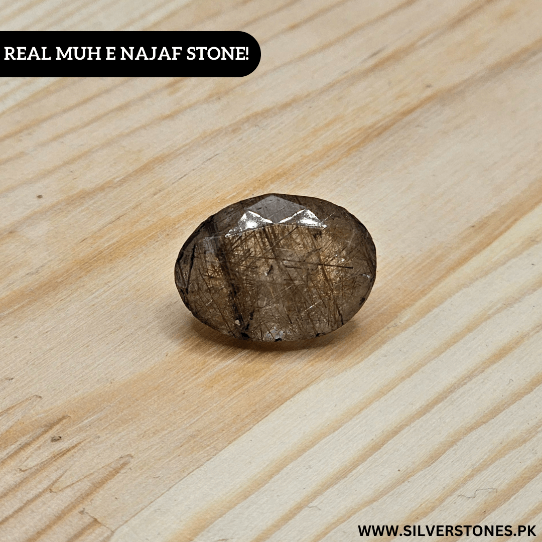 Real Muh-e-Najaf stone showcased on wood surface, highlighting its unique cut and natural beauty.