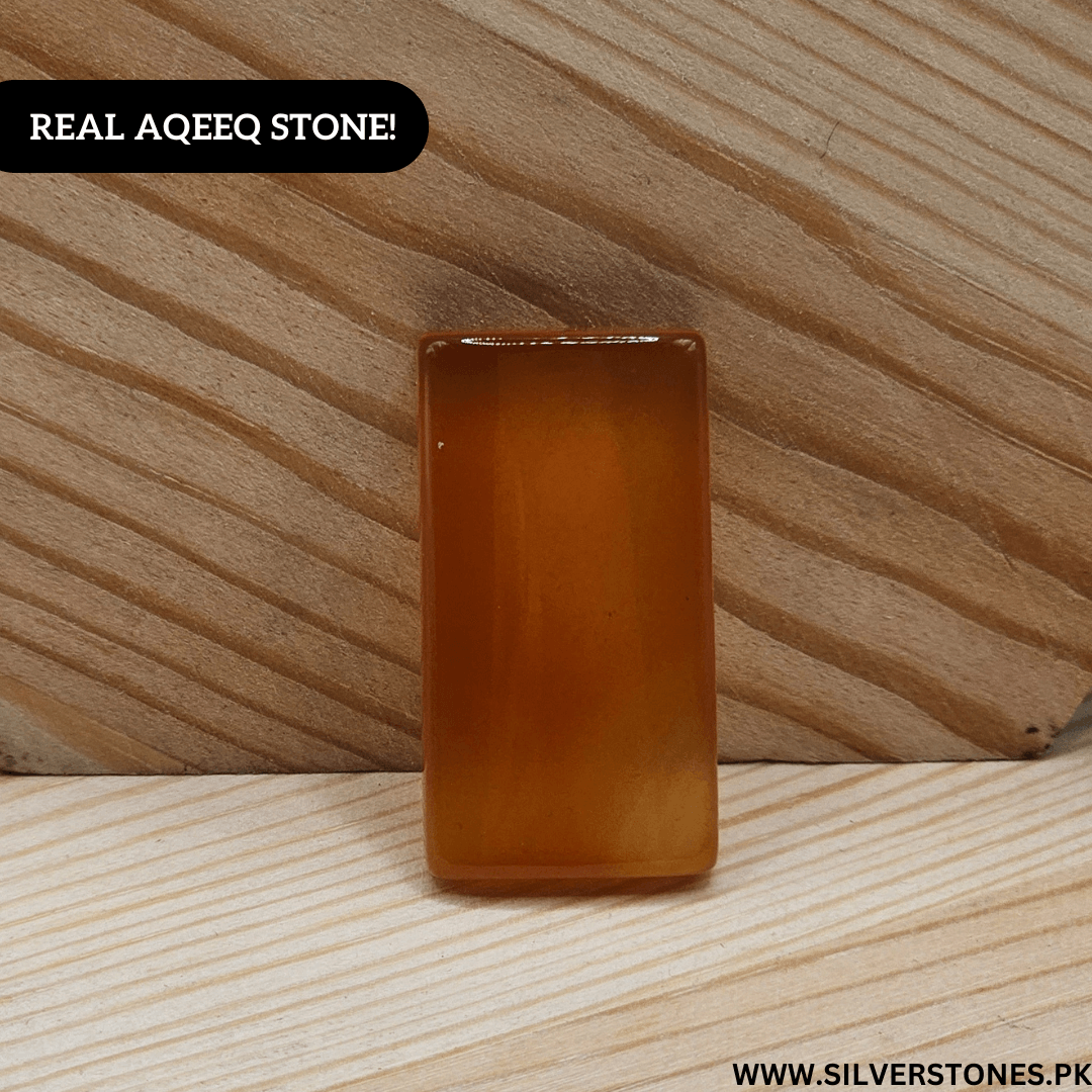 Real Yamni Aqeeq stone showcasing rich color and natural beauty on wooden surface.
