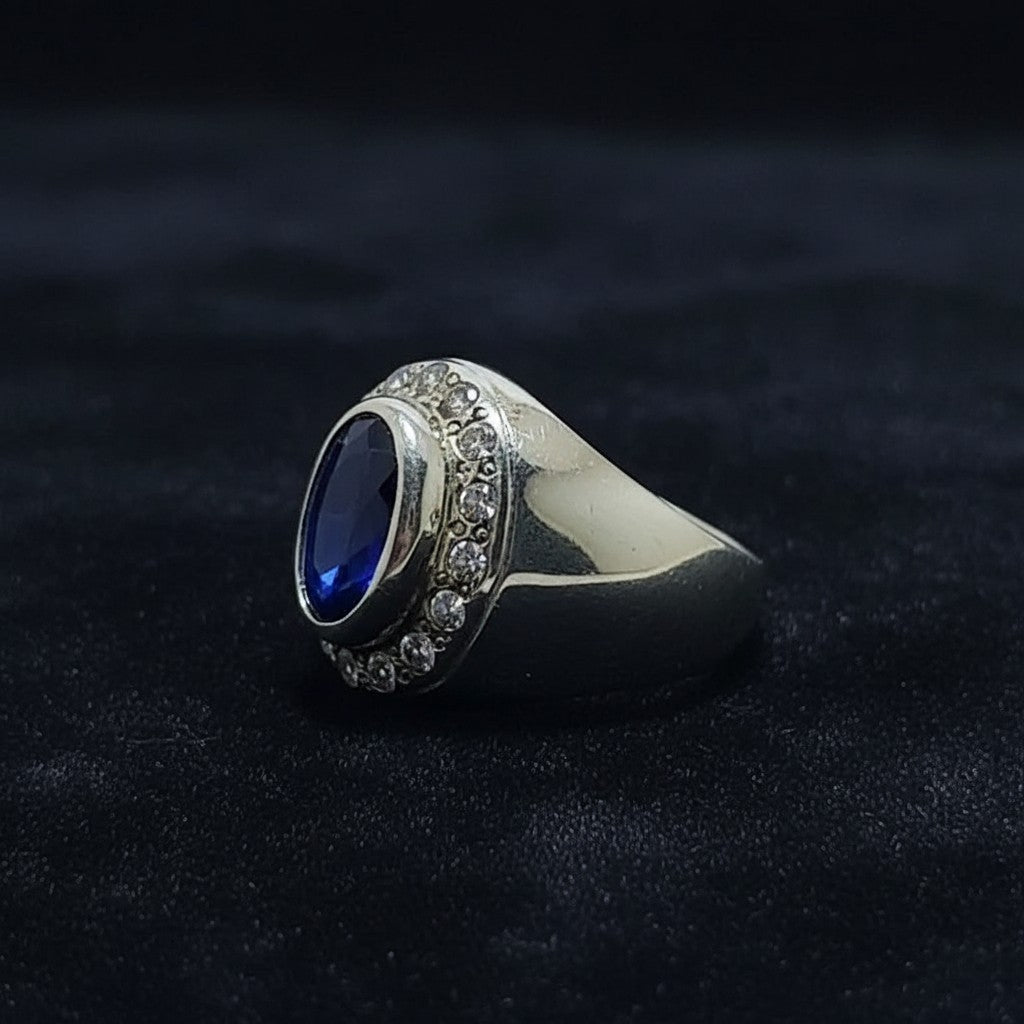 Man wearing 6-7 carat African blue sapphire white zircon pure silver ring handmade Pakistan