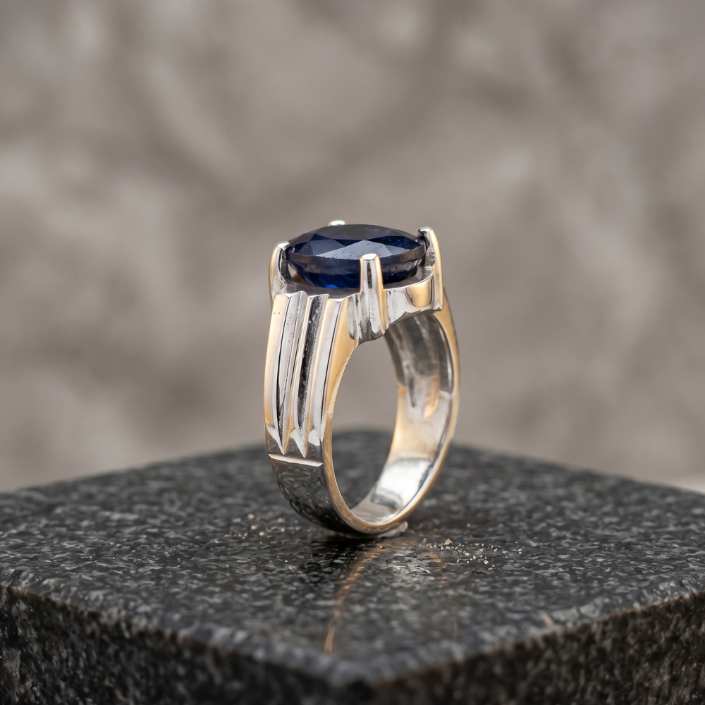 Man wearing 7 carat African blue sapphire pure silver ring Neelam stone Pakistan