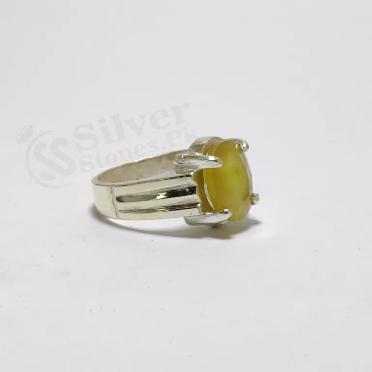 Natural African yellow sapphire Pukhraj stone close-up 7 carat — vivid golden yellow color