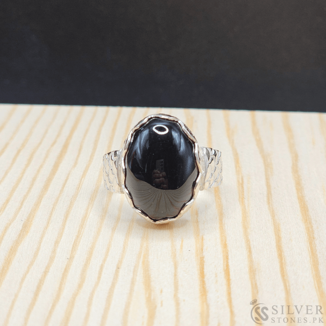 Handmade real Aqeeq silver ring featuring a polished black Aqeeq stone, symbolizing strength and protection.