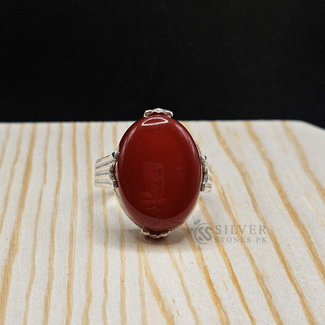 Real Aqeeq Silver (Chandi) Ring showcasing red Aqeeq gemstone, symbolizing strength and protection in handmade design.