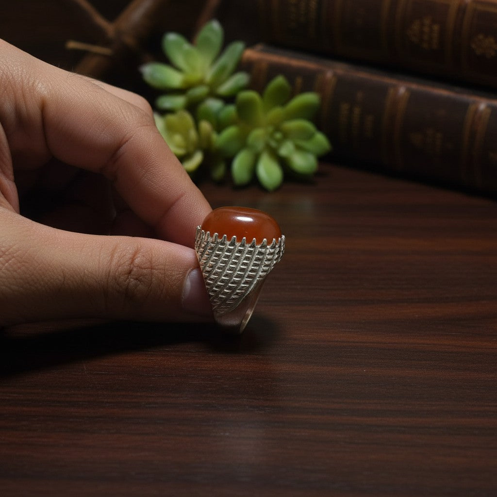 SilverStones.Pk men's ring with oval carnelian gemstone and textured silver band.