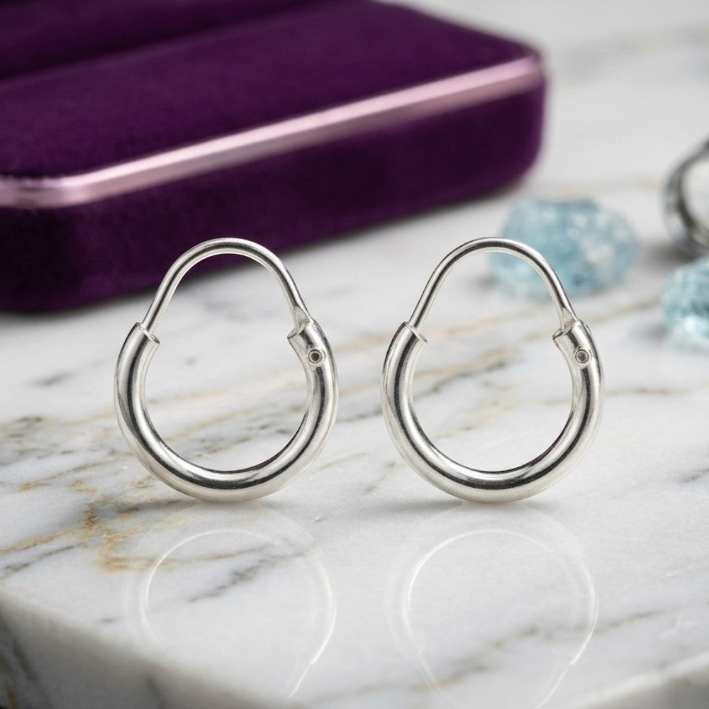 Small chandi bangle hoop earrings pair flat lay pure silver Silverstones Pakistan