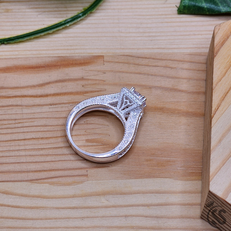 925 Italian silver ladies ring with zircons showcased on a wooden surface, featuring a sparkling design.