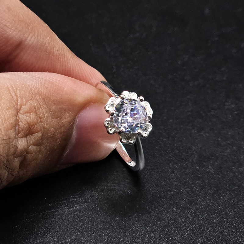 Women's sterling silver ring with sparkling white zircons worn on a hand