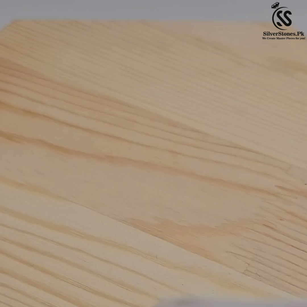 Close-up view of a natural wood surface showcasing fine grains and textures.