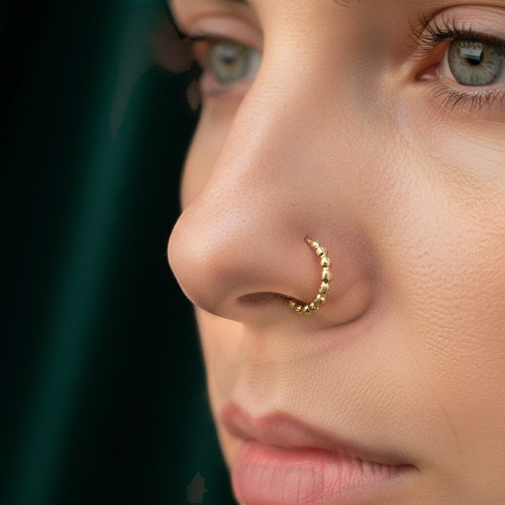 SilverStones.Pk 10mm 24 carat gold-plated sterling silver nose ring with intricate beaded design.