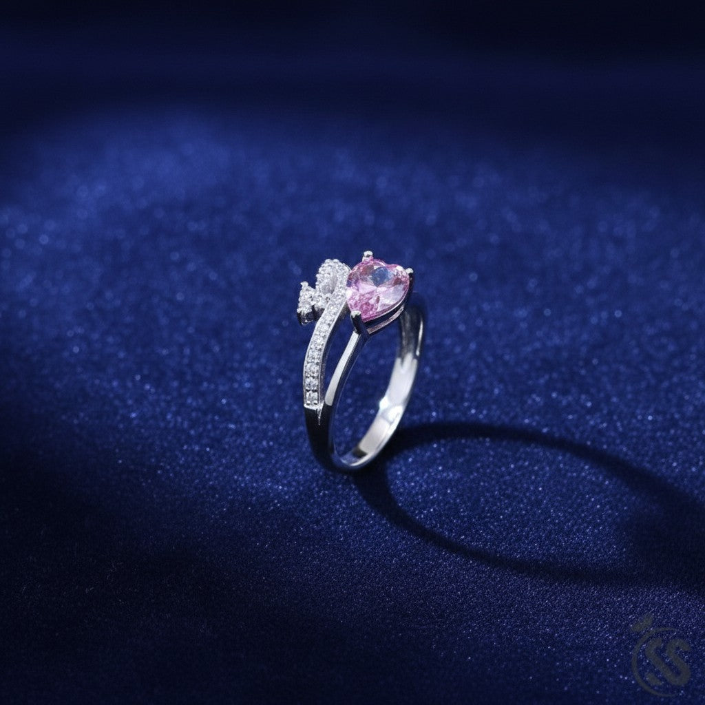 SilverStones.Pk 925 Italian sterling silver ladies ring with a pear-cut pink zircon and small clear zircons.