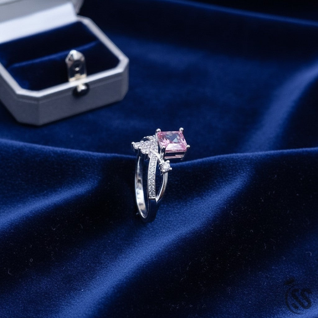 SilverStones.Pk 925 Italian silver ring with square pink zircon and small clear zircons on band.