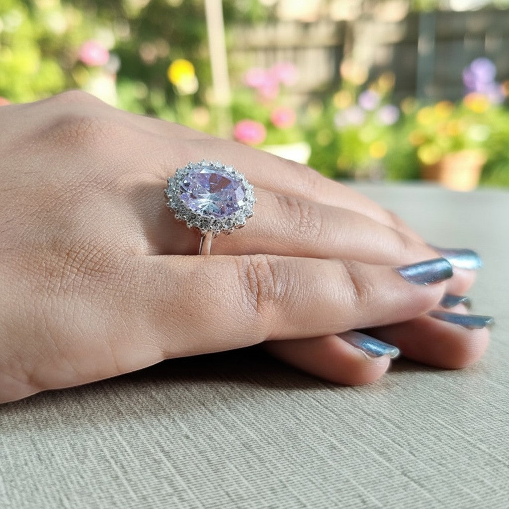 SilverStones.Pk 925 Italian silver ring with a large oval lilac zircon surrounded by smaller clear zircons.