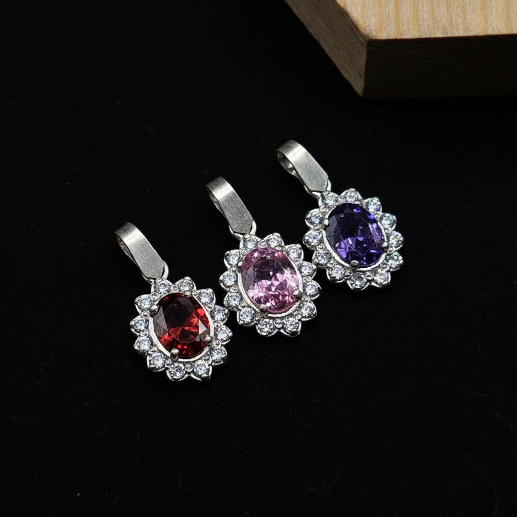 SilverStones.Pk 925 sterling silver pendant with oval red, pink, and purple zircon stones surrounded by smaller clear stones.