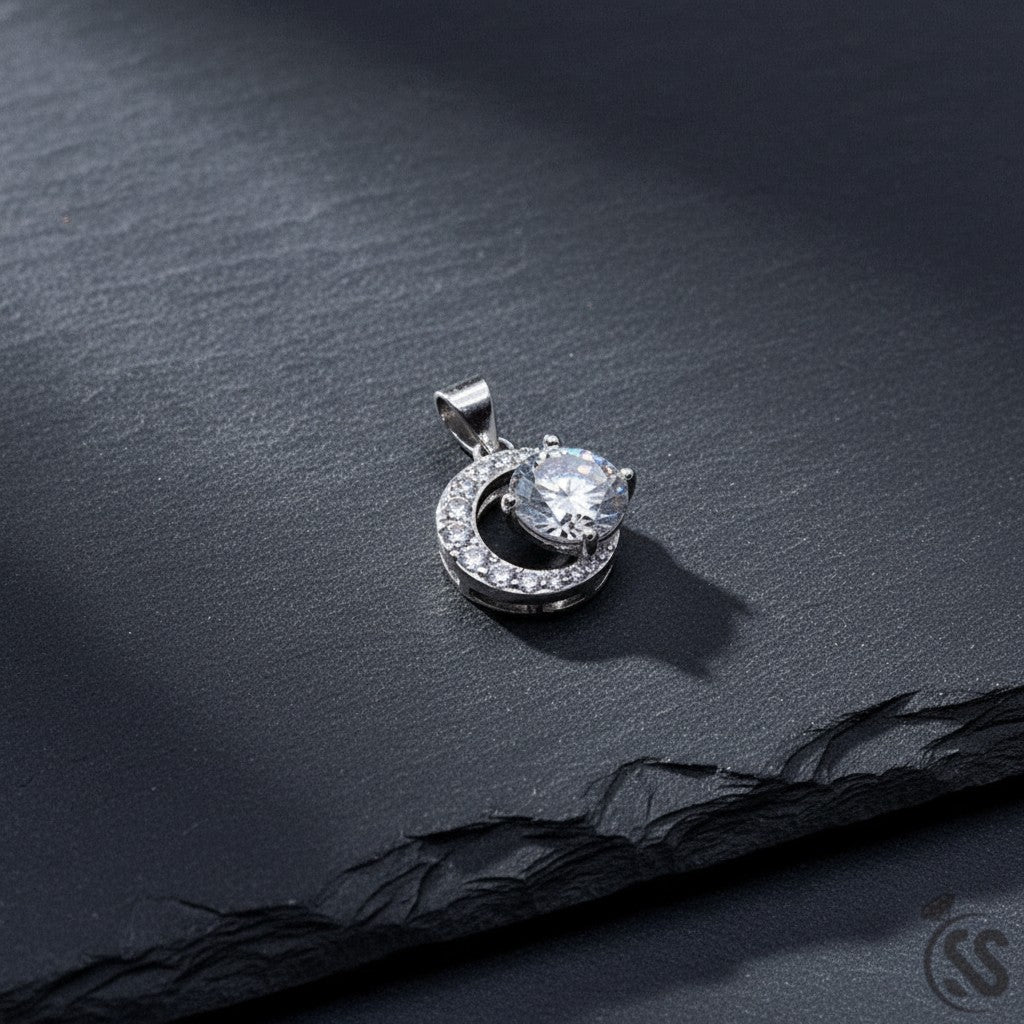 SilverStones.Pk Italian 925 sterling silver pendant with a large central zircon stone surrounded by smaller stones in a crescent design. Rhodium plated.