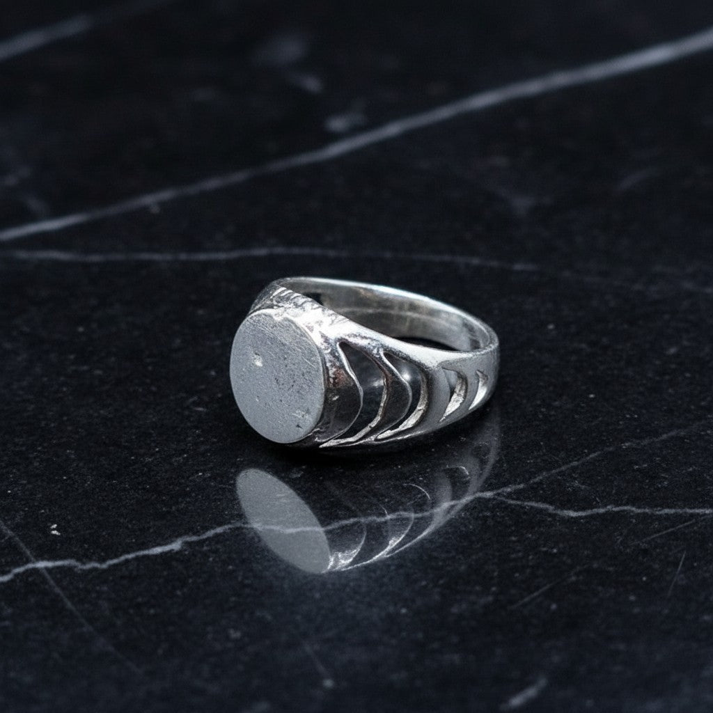 SilverStones.Pk 925 sterling silver baby boy ring with a smooth oval face and cut-out band detail. Hypoallergenic and comfortable for daily wear.