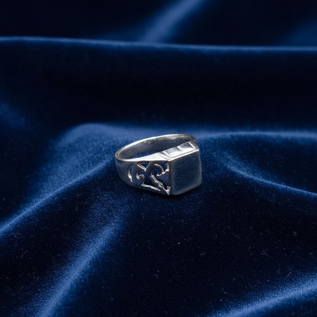SilverStones.Pk 925 sterling silver baby boy ring with cut-out scroll design on band. Square face.