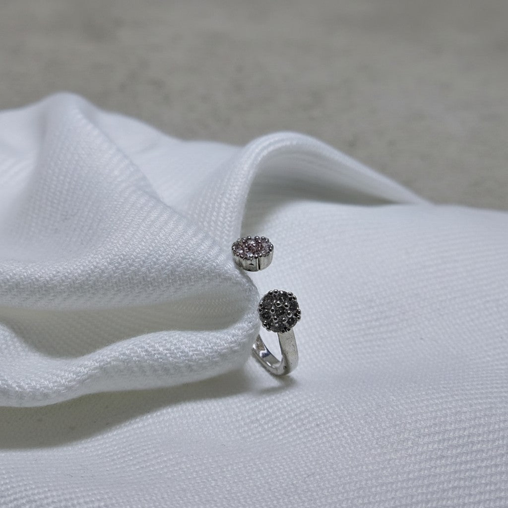 SilverStones.Pk adjustable ring with two clusters of small zircon stones, crafted from color silver.