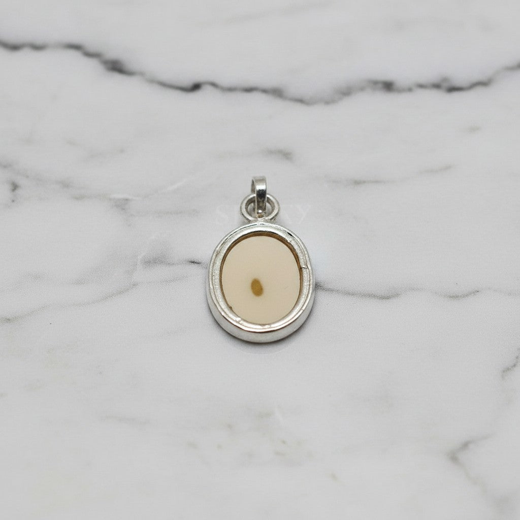 SilverStones.Pk oval pendant with a light cream-colored Aqeeq stone featuring a small brown inclusion.