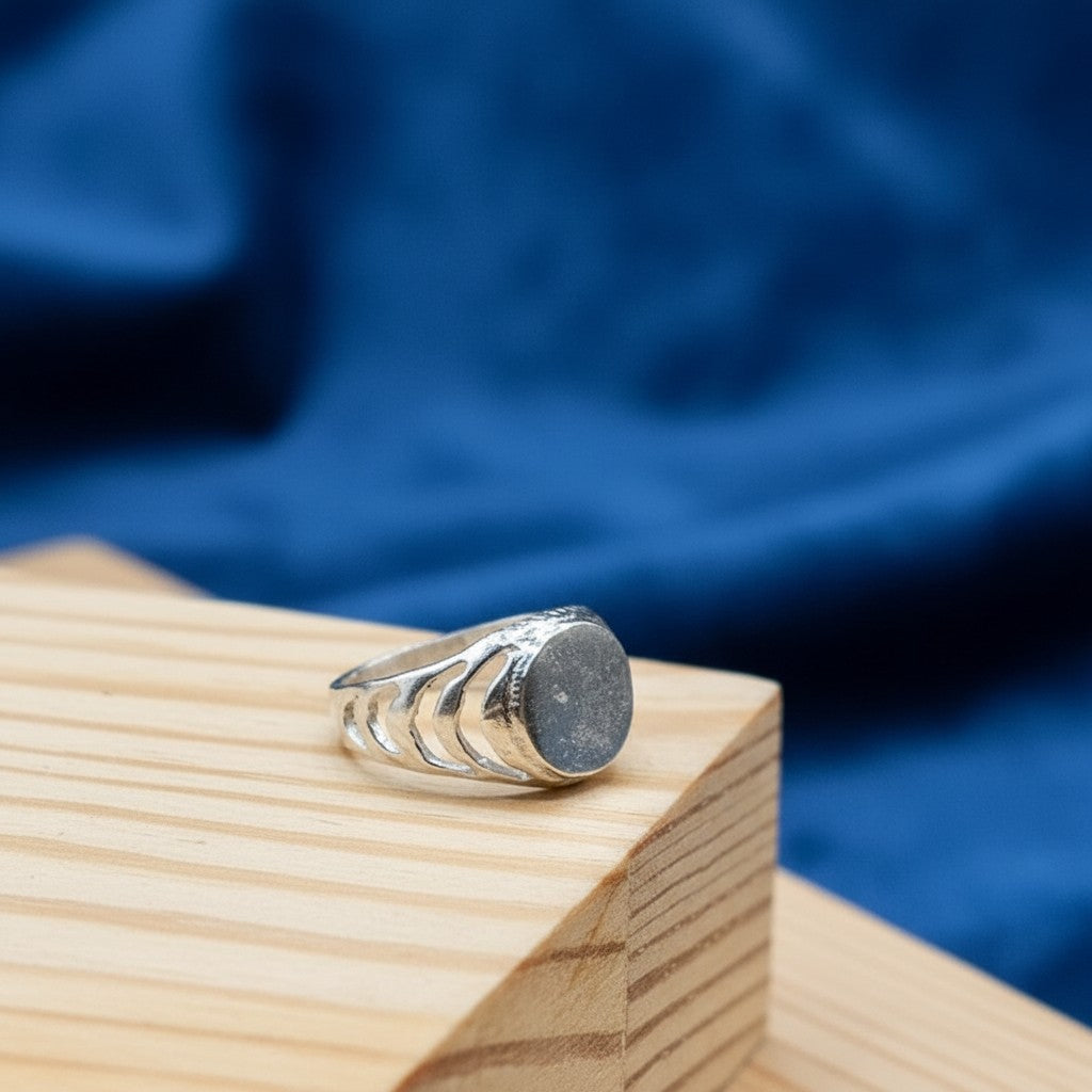 SilverStones.Pk 925 sterling silver baby boy ring with a smooth oval face and cut-out crescent moon design on the band.