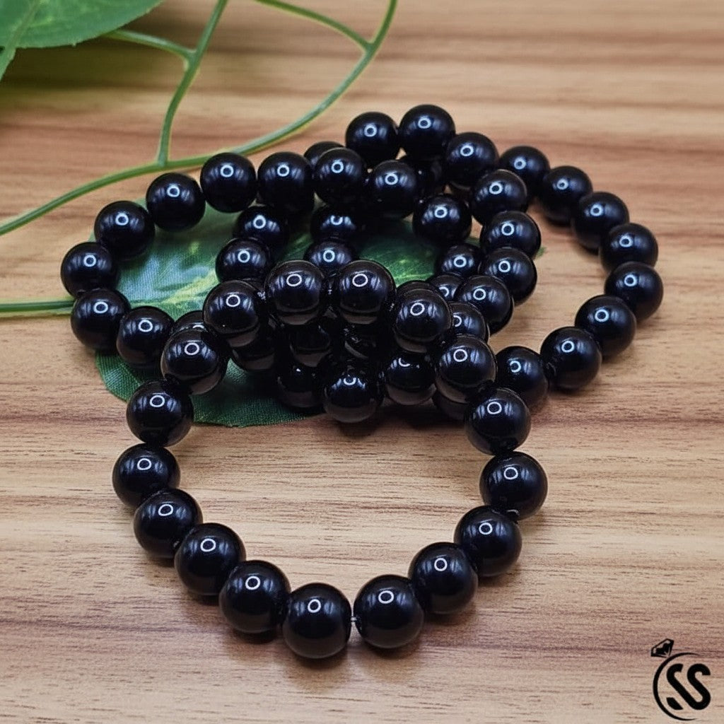 SilverStones.Pk black real aqeeq stone beaded bracelet with a polished finish.