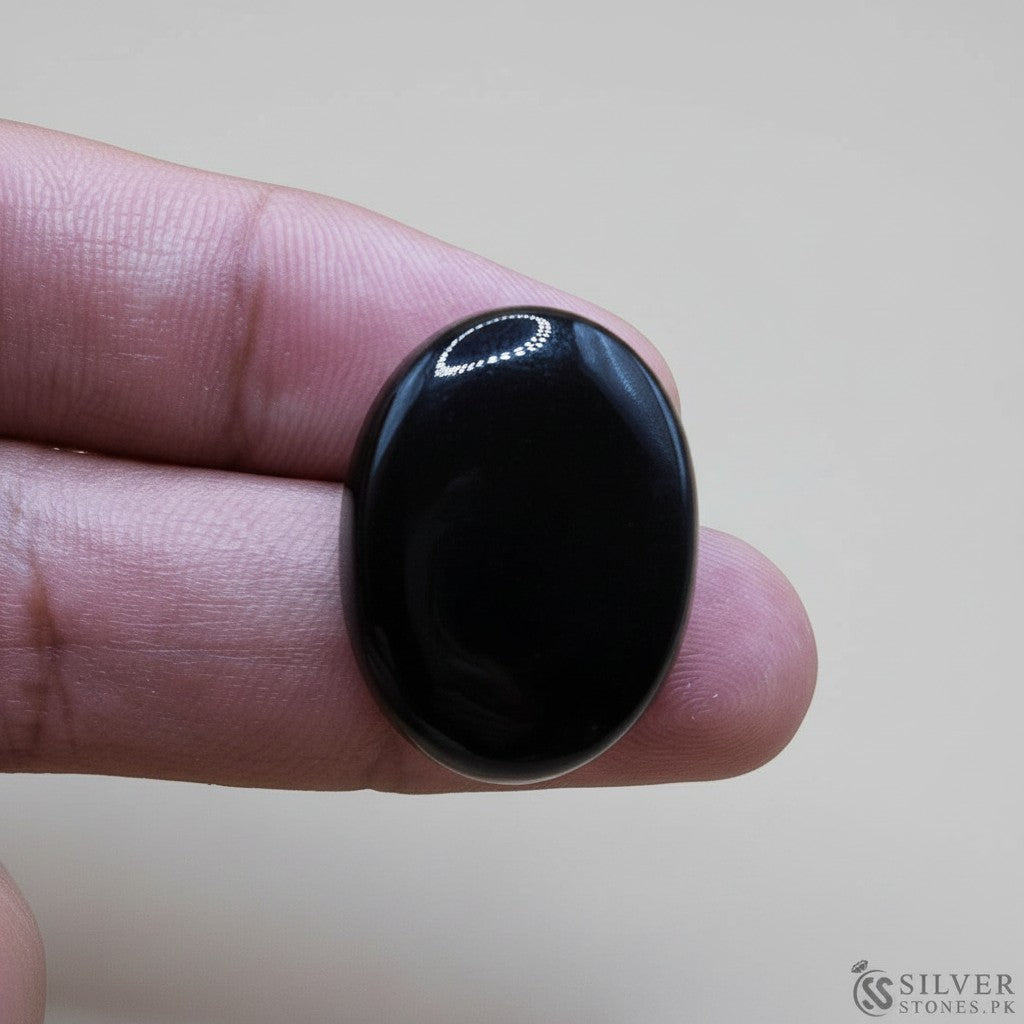 SilverStones.Pk real black irani aqeeq gemstone, oval cabochon cut, polished finish, 7.36 grams.