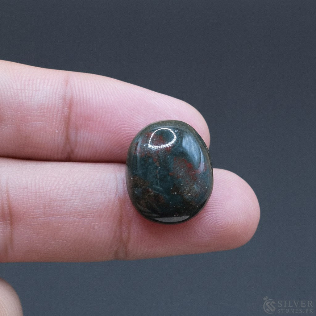 SilverStones.Pk real bloodstone gemstone, deep green with red inclusions, oval cabochon cut, 26.65 carats.