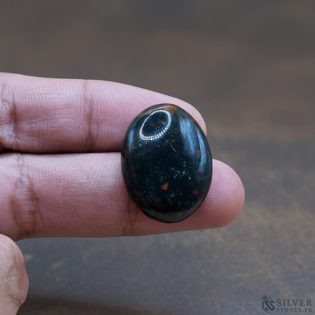 SilverStones.Pk real bloodstone gemstone, deep green with red inclusions, oval cabochon cut.