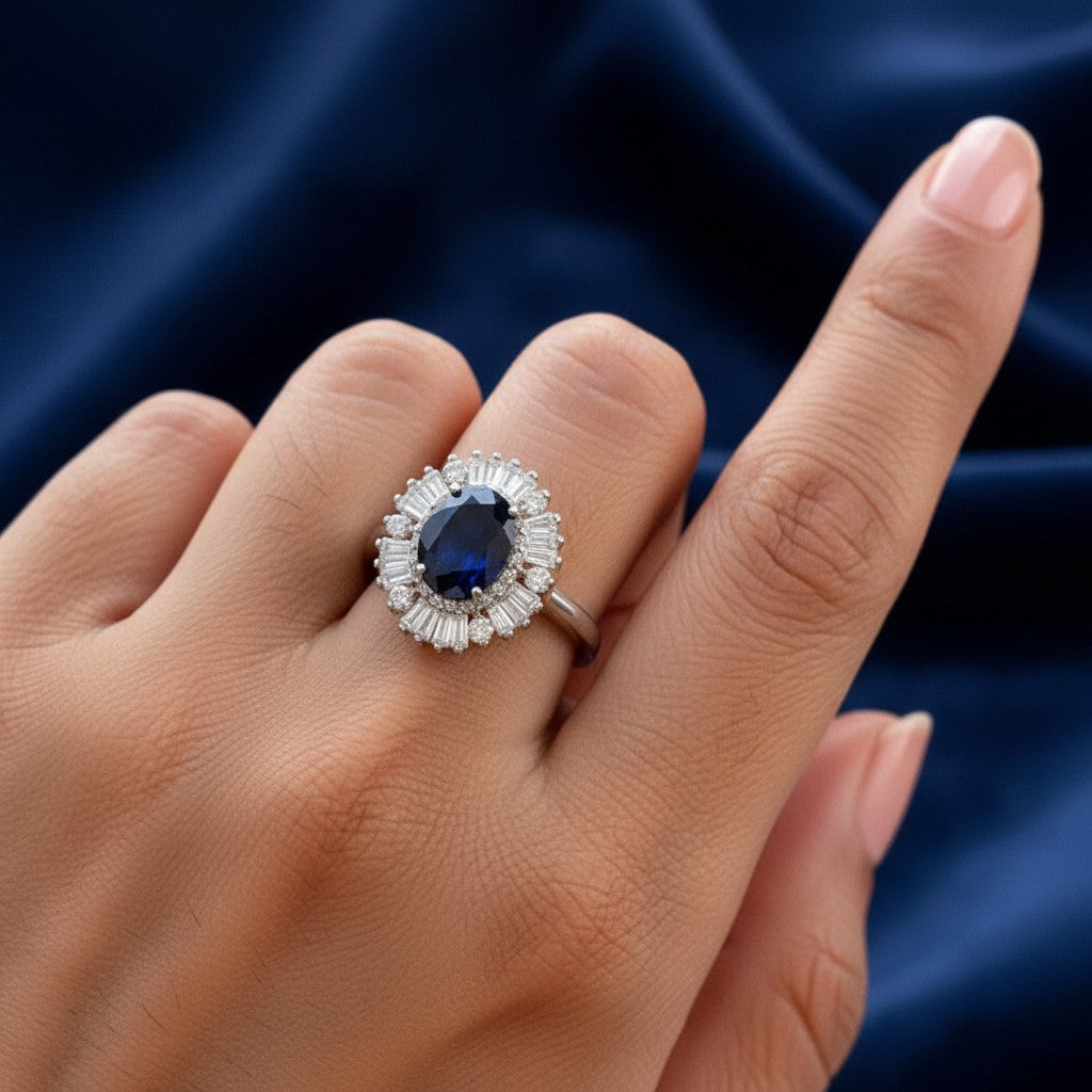 SilverStones.Pk oval blue sapphire ring with surrounding baguette and round diamonds in 925 sterling silver.